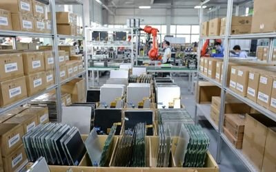 LCD panel production line showing organized inventory and workers ensuring long-term stable supply.