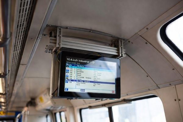 10.4-inch industrial LCD module installed inside a UK public transport vehicle, wide-temperature and anti-vibration design for transportation display.