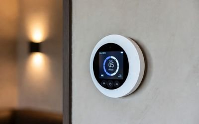 Smart home circular dial controller with a round LCD display.