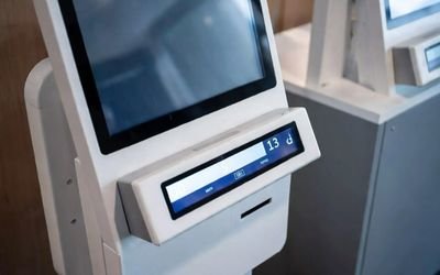 Self-service terminal featuring a slim bar LCD screen displaying queue numbers and notifications.