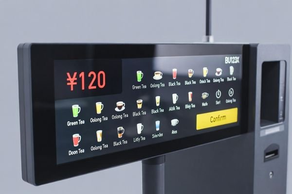 BU123X bar LCD display embedded in a vending machine showing price and user guidance UI