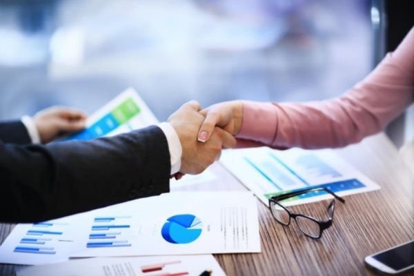 Business handshake during LCD display module project discussion