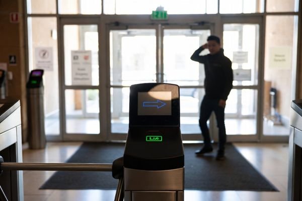 A photo showing glare on a display screen at a building entrance