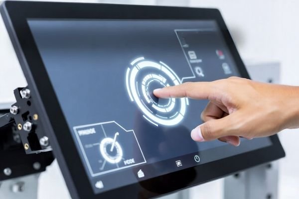 Touch panel integration image showing finger interaction with a custom LCD touch display in industrial equipment
