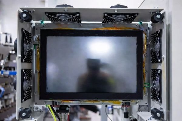 An industrial device running continuously in a demanding environment, highlighting long duty cycle and thermal stress on the display system